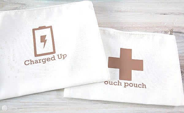 White canvas pouches with a swiss cross and charging symbol.