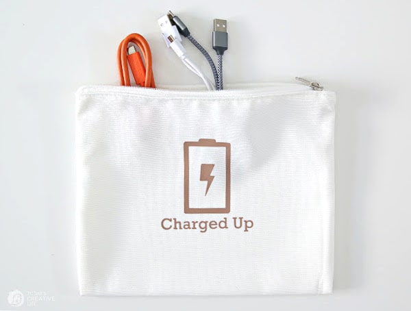What is a Cricut? White cosmetic bag for organizing charging cords.
