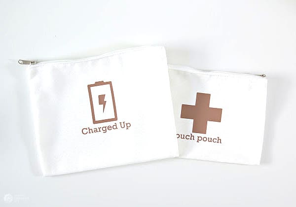 White cosmetic bags for organizing chargers and first aid supplies.