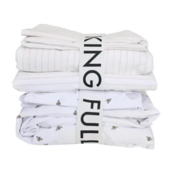 two sets of sheets stacked with elastic band labels