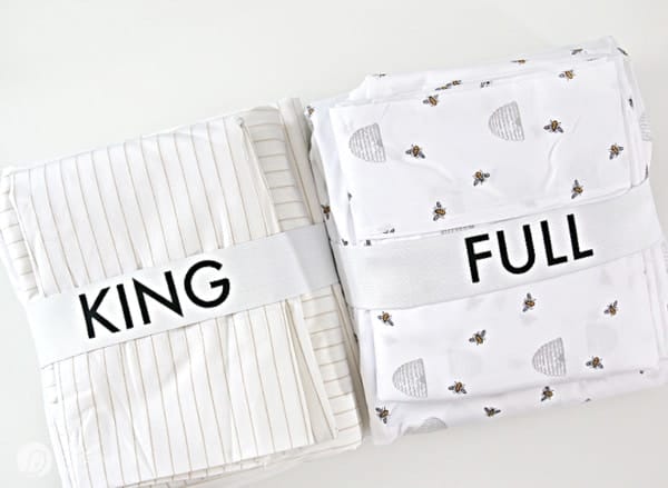 2 sets of sheets with King and Full labels -Linen Closet Organizing with Cricut