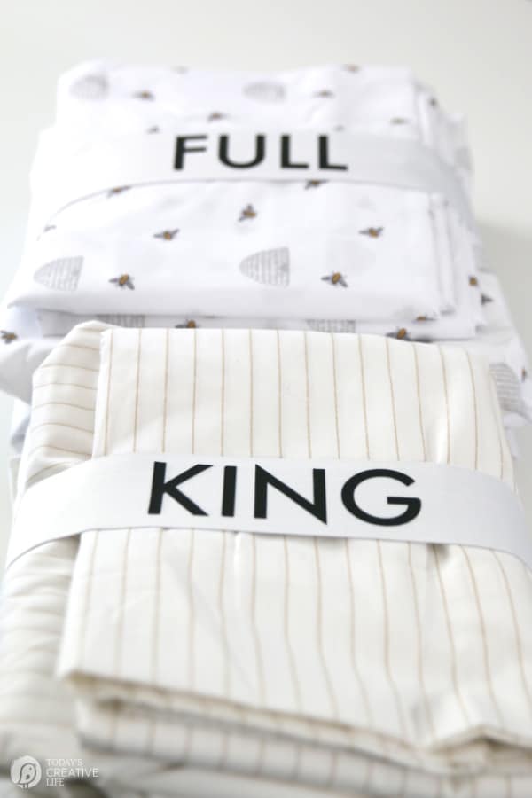 2 sets of sheets with elastic wrapped around that says KING or FULL