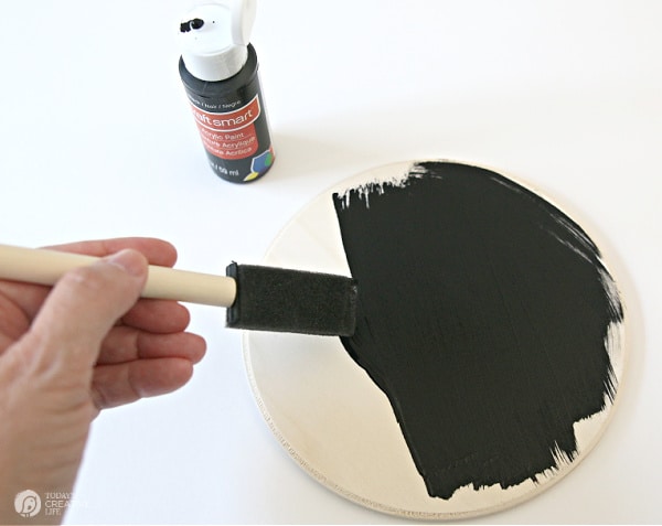 painting round wood plaque black