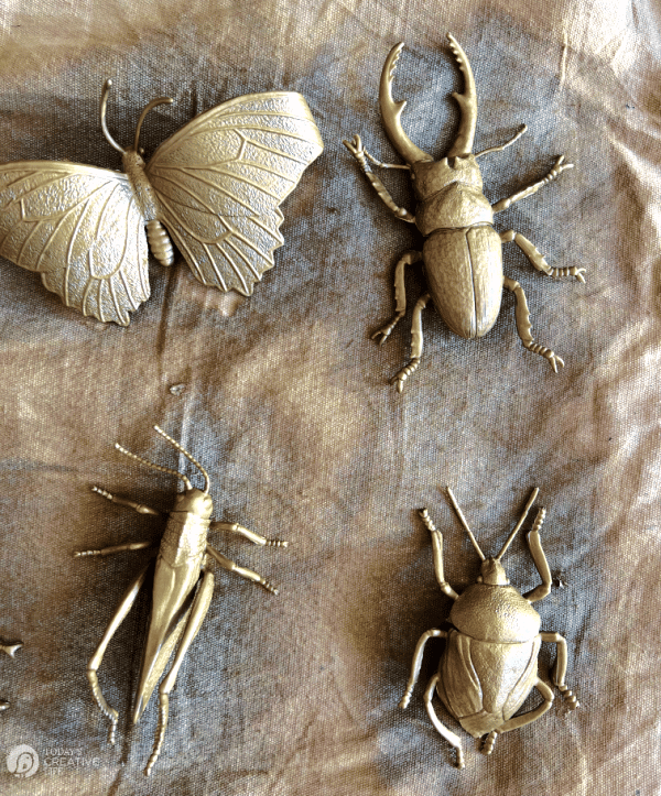 Gold painted plastic bugs