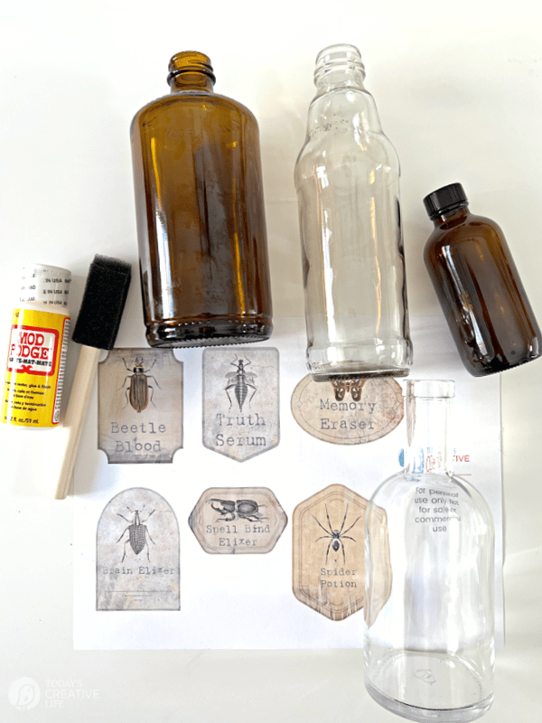 Supplies for making Halloween Apothecary Jars.