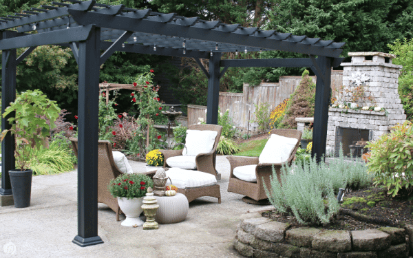 Black pergola and outdoor fireplace