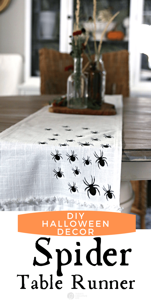 White table runner with vinyl spiders for DIY Halloween Decor