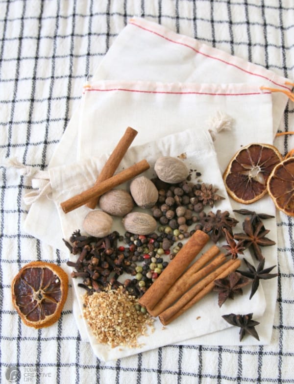 Spices for hot cider or wine arranged on a small cotton bag