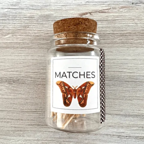 Bottle with butterfly label filled with wooden matches for Apothecary Matches