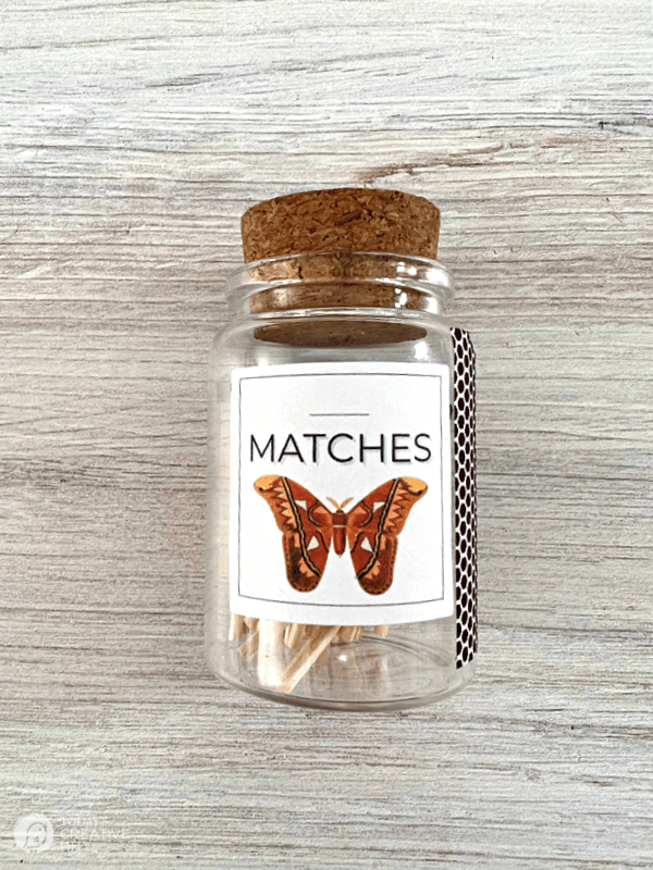 Bottle with butterfly label filled with wooden matches for Apothecary Matches