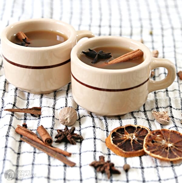 two vintage mugs filled with hot apple cider