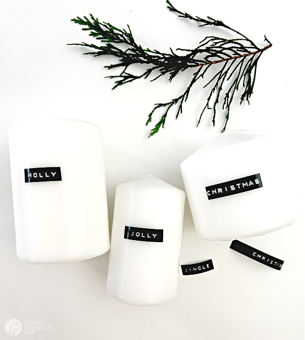 White candles with black labels for diy Christmas decorating.