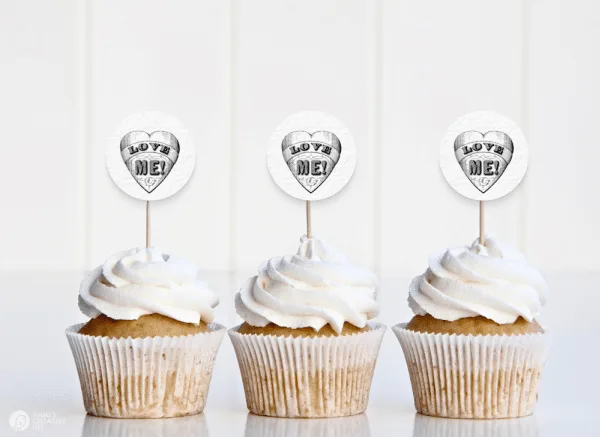 Vanilla cupcakes with vintage LOVE ME design for homemade cupcake toppers