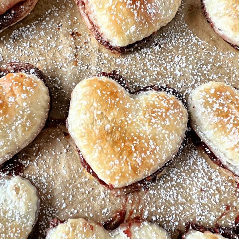 Baked golden brown puff pasty hearts