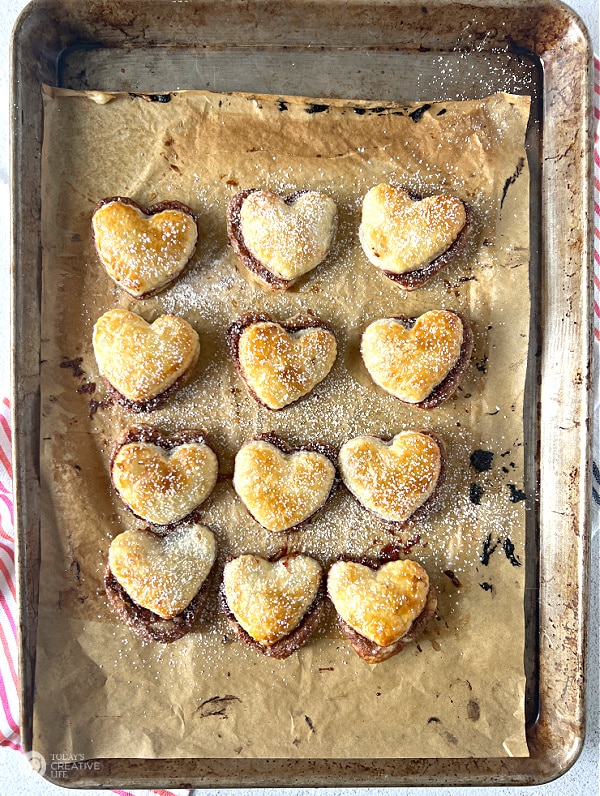 golden brown puff pastry hearts filled with chocolate. Puff pastry dessert recipe.