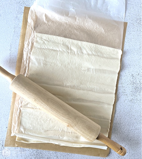Puff Pastry sheet with rolling pin.