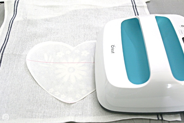 Cricut Easypress ironing on the heart graphic