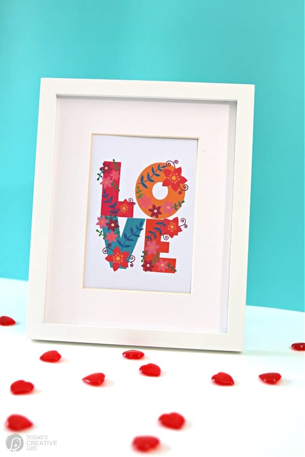 Framed LOVE with a turquoise background