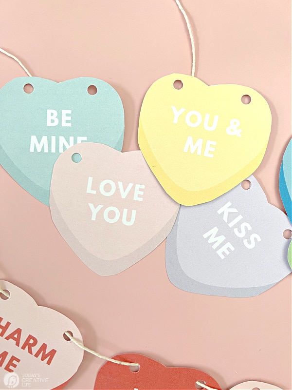 Valentine decor ideas with printable conversation hearts.
