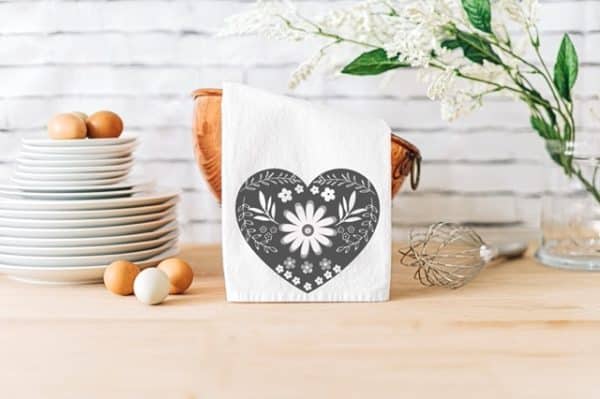 Kitchen with white dish towel that had a grey heart design for DIY Valentine's Day Decorations.