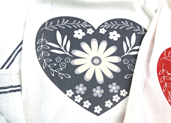 Grey heart designed ironed onto white dish towel for DIY Valentine's Day decorations