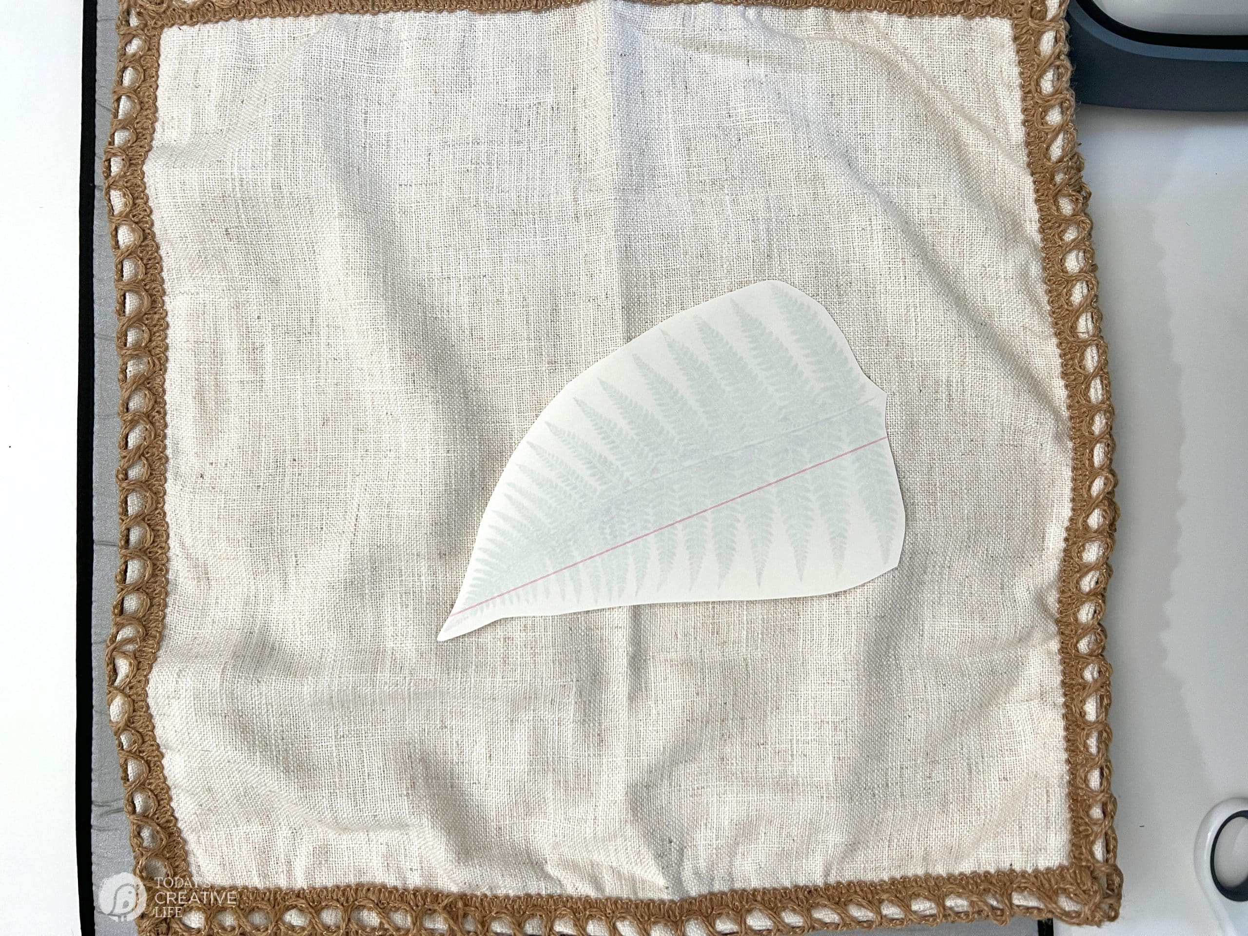 Making an iron-on transfer pillow with image face down.