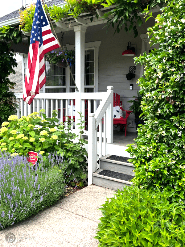 Patriotic porch with American flag.