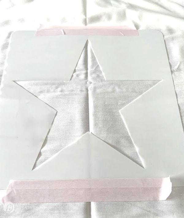 Star Stencil taped onto fabric for Patriotic Decorating ideas