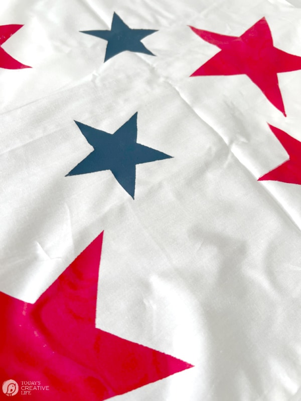 Red and blue stars on white fabric for patriotic decorating ideas.