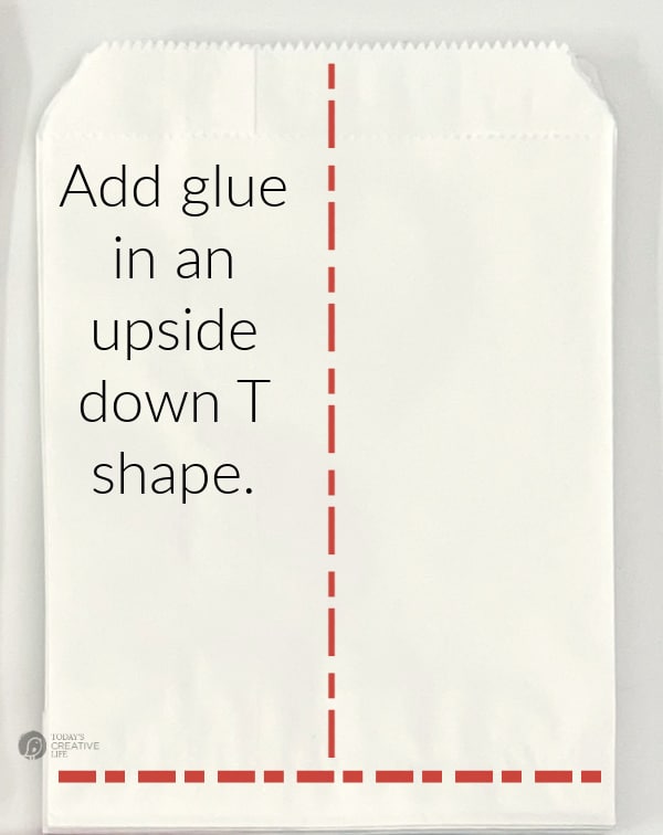 White paper bag with directions on where to place the glue.