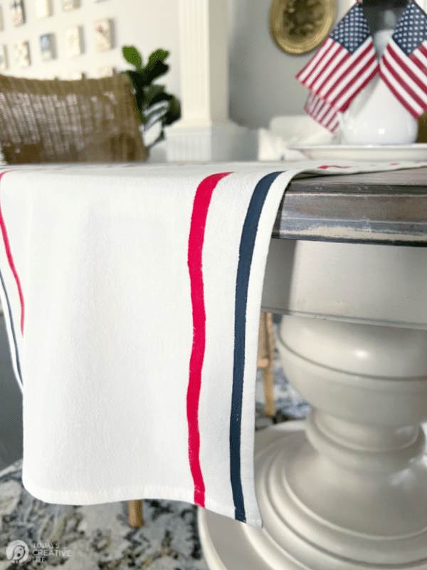 Red and Blue Stripes on white table runner hanging off table