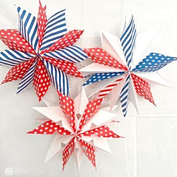 3 paper stars made with patriotic patterned paper bags