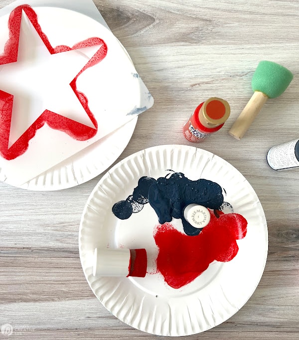 Paint on paper plates with a star stencil