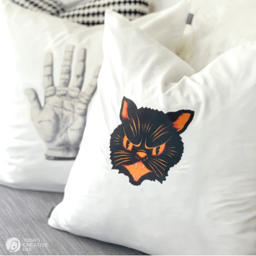 White pillows with Halloween graphics on them.