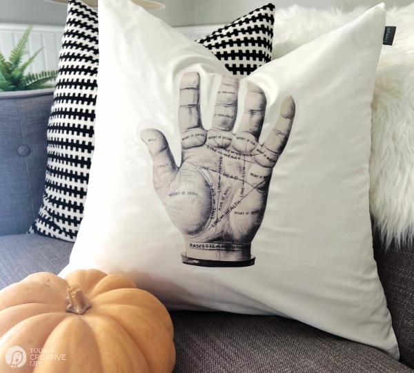 White Pillow with Halloween Palm reading image.