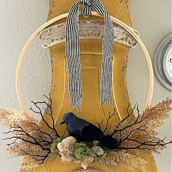 Crows nest wreath hanging on a Swedish Mora Clock