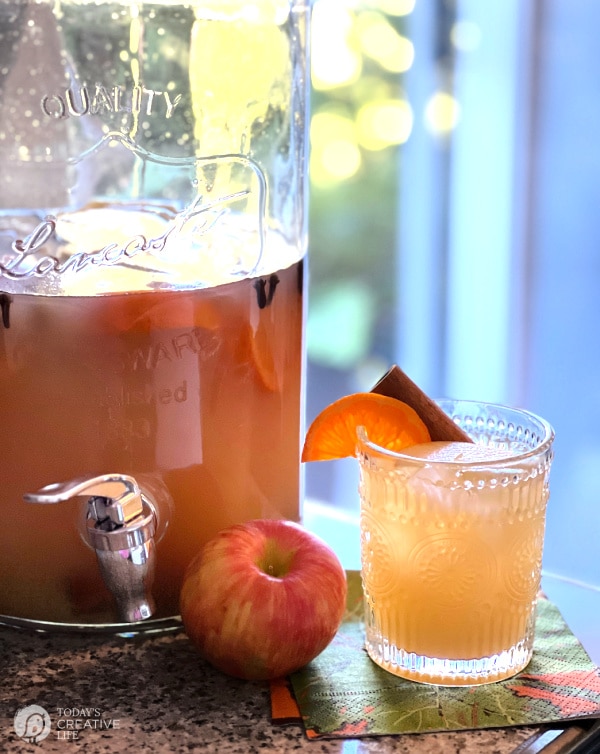 Drink container and glass with apple cider sangria