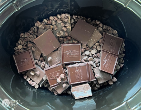 Chocolate squares, chocolate chips in black crockpot
