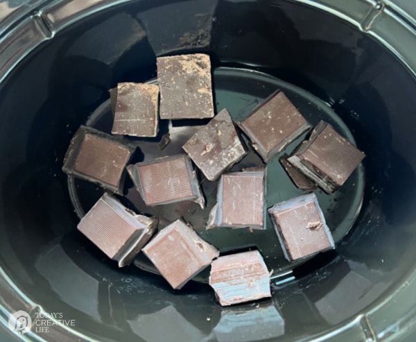 chocolate squares in a black crockpot