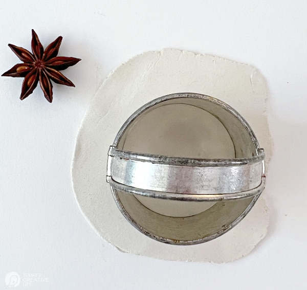 Christmas Ornament DIY - round cookie cutter on white clay