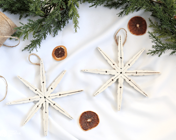 Two white DIY snowflake christmas ornaments