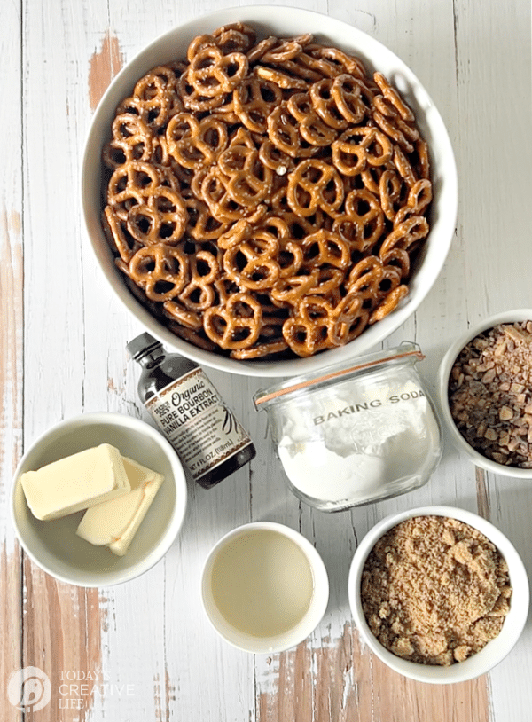Butter toffee pretzels recipe ingredients on a white table.