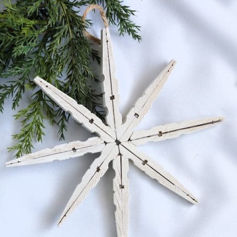 White snowflake made from wood clothespins