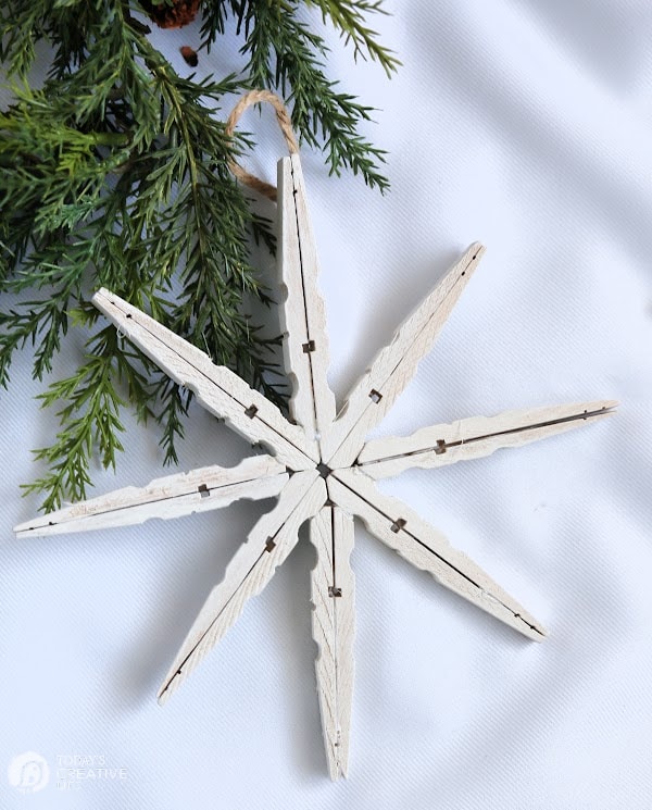 White snowflake made from wood clothespins