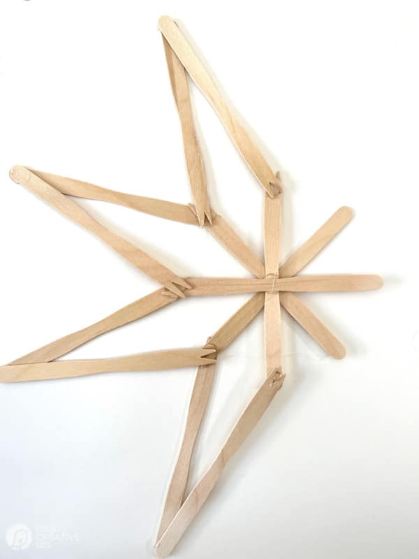Popsicle sticks glued together to make a wooden star