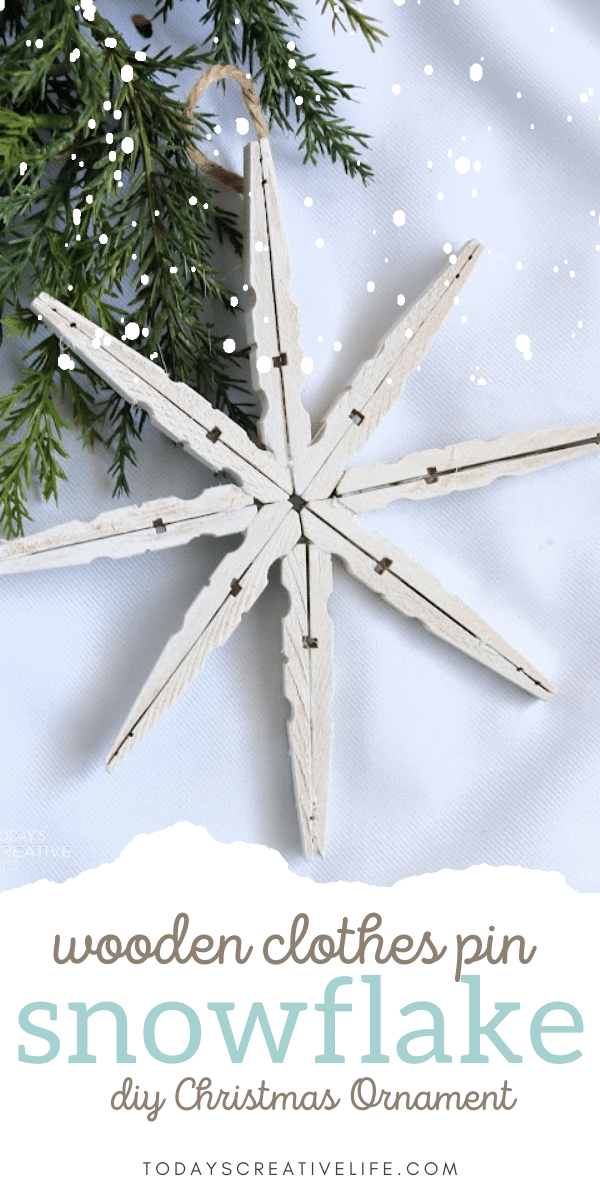 White snowflake made with wooden clothes pins