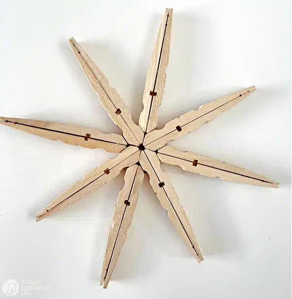 Final steps for making a wood clothespin snowflake