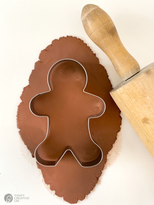 Brown clay with a gingerbread man cookie cutter