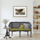 Living room setting with Thanksgiving decor wall art.
