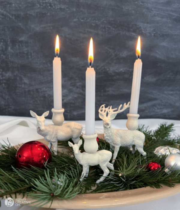 White painted reindeer with white lit candles. DIY Reindeer Candle holders